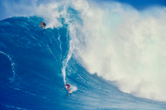 laird-on-the-left-shares-a-monster-wave-with-buzzy-at-peahi-on-maui-during-the-massive-code-red-swell-of-jan-28-1998